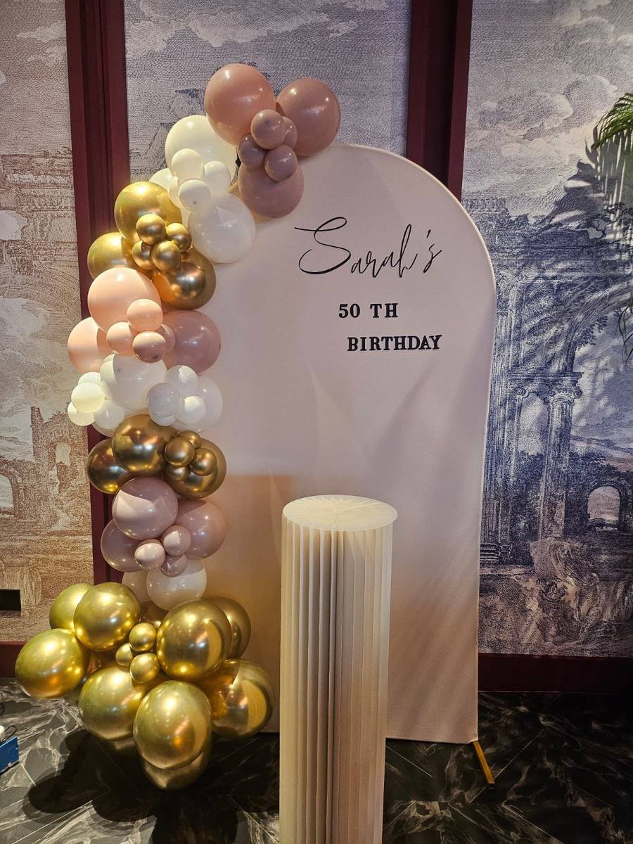 Elegant birthday balloon arch