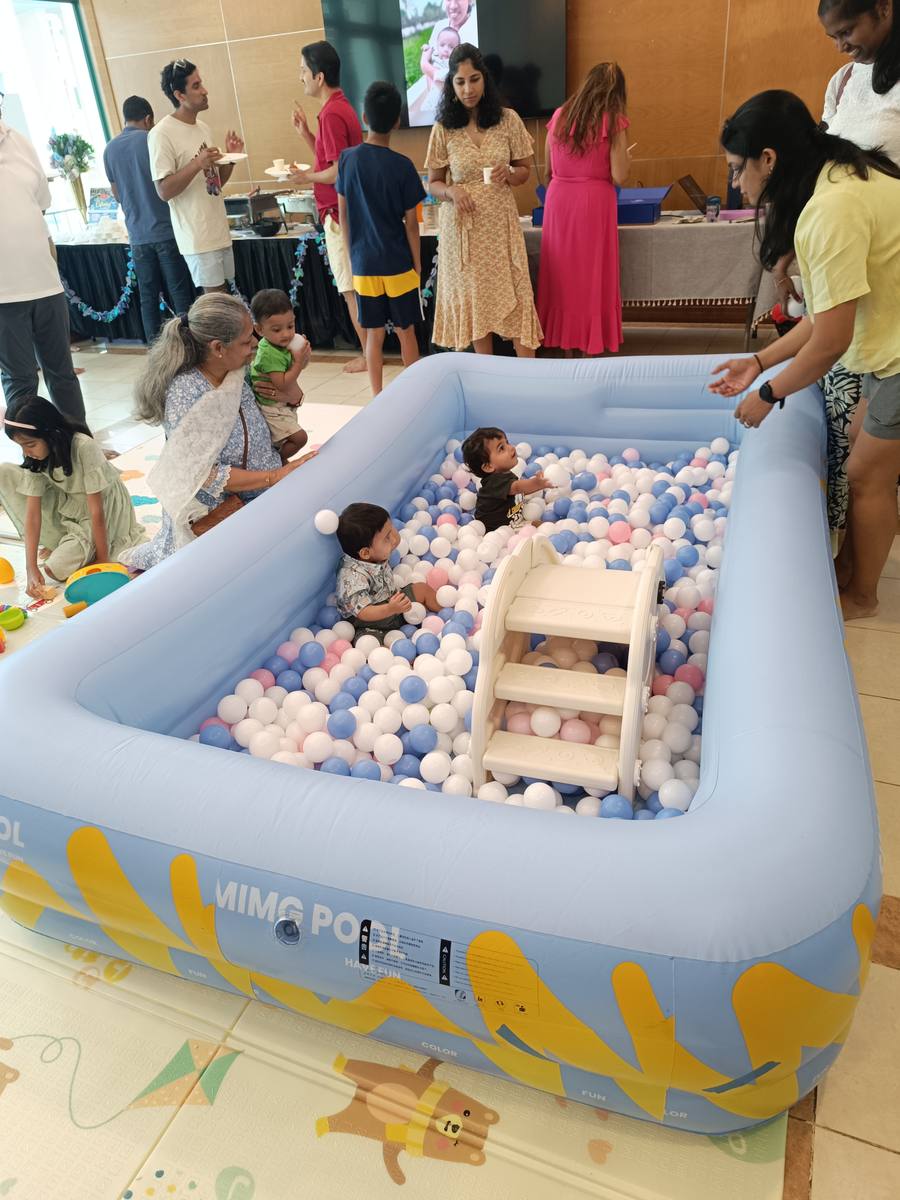 Babies in blue ball pit